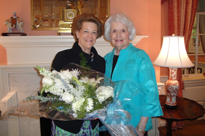 Sherry holding flowers presented by Carolyn and Zeta Tau Alpha. Installation