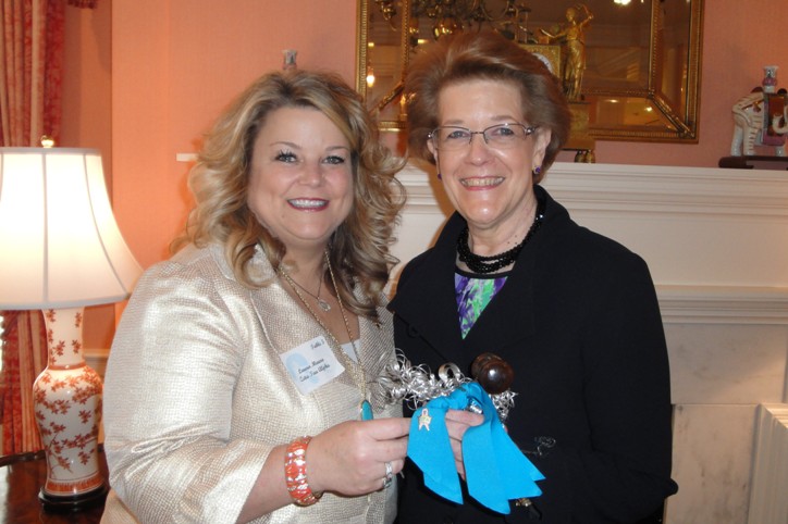 Laura Mauro handing Sherry the presidential gavel. Installation