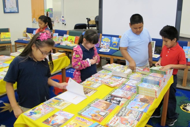 Reading Is Fundamental: Students selecting their new books. rif