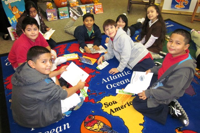 Reading Is Fundamental: Students enjoying their new books. rif